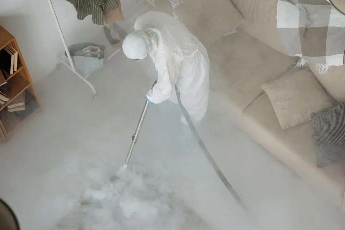 Biohazard cleanup technician in protective equipment, Cheswick, PA